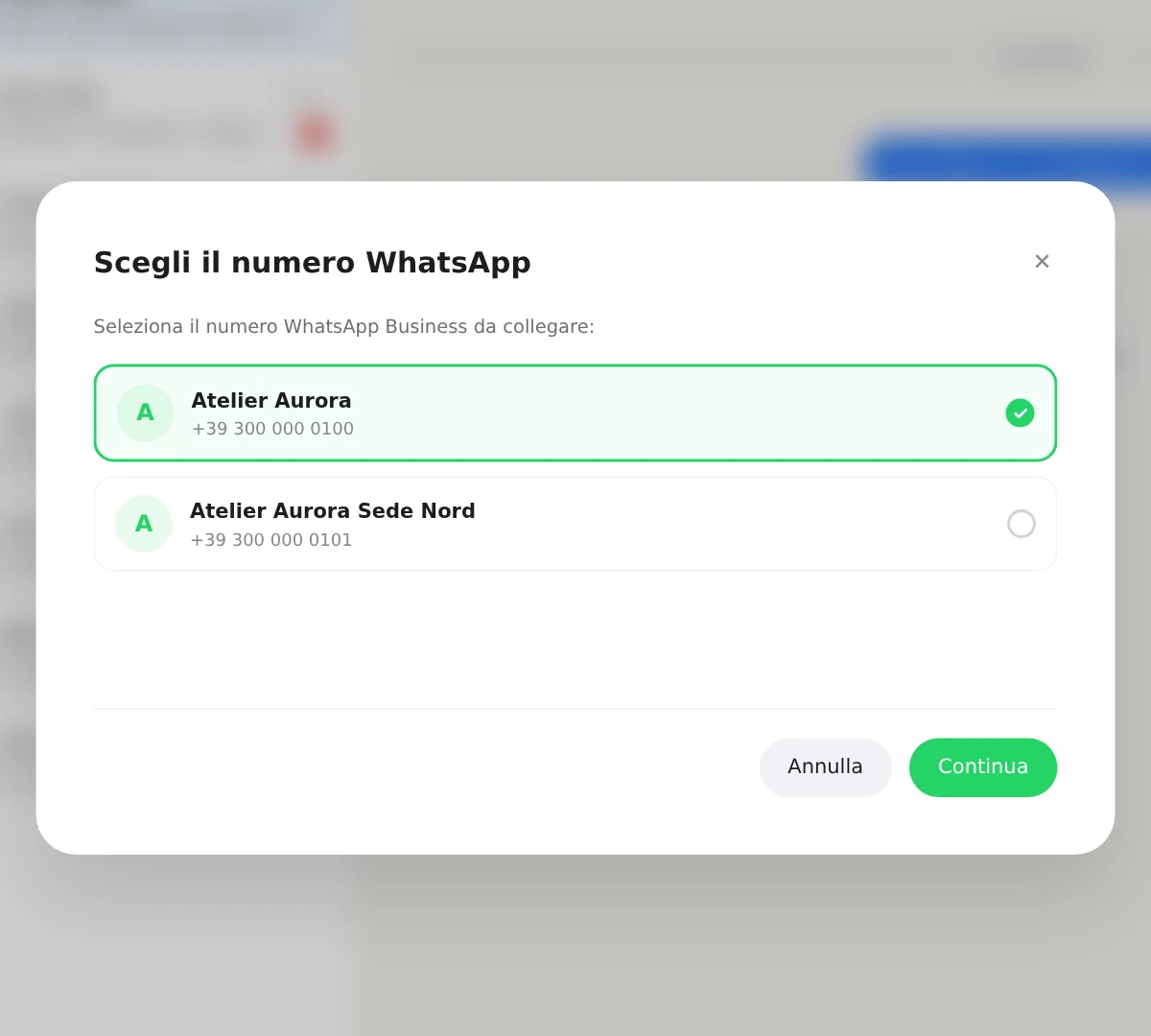 La schermata «Scegli il numero WhatsApp» con due numeri e il pulsante Continua.